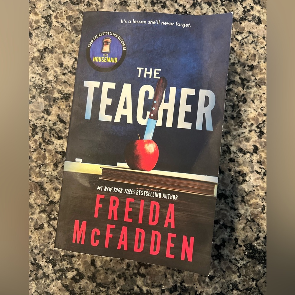Paper back book “The Teacher” by Freida McFadden